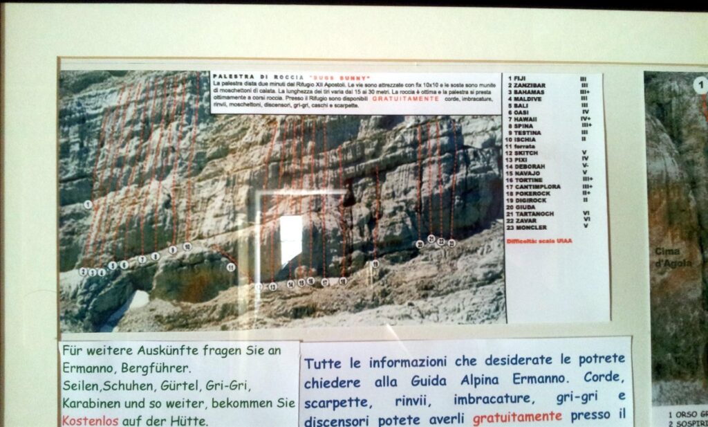 Facciamo la foto al quadretto che mostra le falesie circostanti. Ci sono anche vie lunghe, ma visto che il meteo &egrave; incerto per il pomeriggio, decidiamo di dedicarci alle falesie che stanno a pochi minuti dal rifugio e sono agevoli per la fuga veloce in caso di pioggia a grappolo. Questa &egrave; la falesia pi&ugrave; facile (ma anche pi&ugrave; carina).